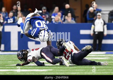 INDIANAPOLIS, IN - JANUARY 08: Indianapolis Colts tight end Jelani Woods  (80) is tackled by Houston Texans defensive back Tavierre Thomas (2) and  Houston Texans defensive back Desmond King II (25) during