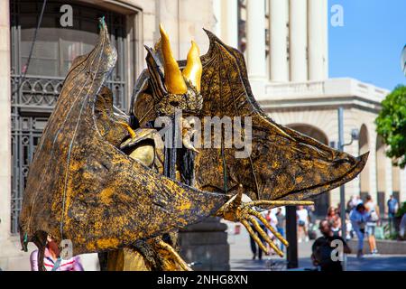 Golden gargoyle demon living statue performer on La Rambla, Barcelona, Catalonia, Spain Stock Photo