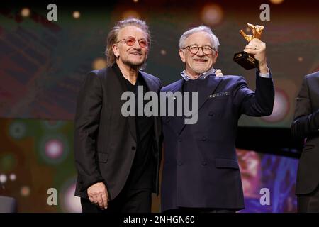 „U2“ Singer Bono and Steven Spielberg seen on stage at Honorary Golden Bear Award and homage for Steven Spielberg during the 73rd Berlinale Internatio Stock Photo