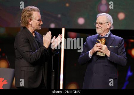 „U2“ Singer Bono and Steven Spielberg seen on stage at Honorary Golden Bear Award and homage for Steven Spielberg during the 73rd Berlinale Internatio Stock Photo