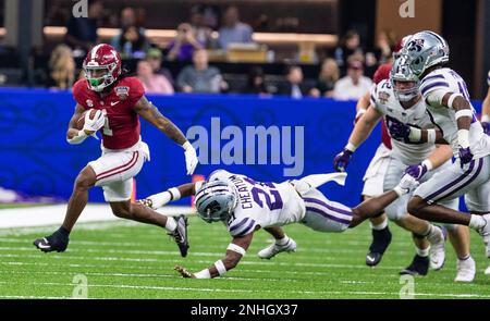 Jahmyr Gibbs of the Alabama Crimson Tide is tackle by Demani