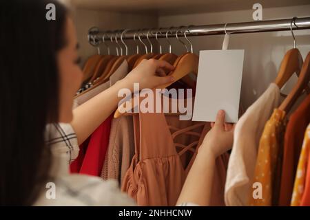 Scented sachet with flowers and stylish clothes on hanger Stock Photo -  Alamy