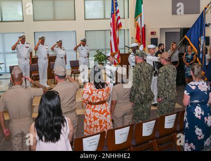 220729-N-UJ449-1014 NAVAL AIR STATION SIGONELLA, Italy (July 29, 2022)— The official party salutes as the colors are paraded during a change of command ceremony for U.S. Naval Medical Research Unit 3 on Naval Air Station Sigonella, July 29, 2022. NAS Sigonella’s strategic location enables U.S., allied, and partner nation forces to deploy and respond as required, ensuring security and stability in Europe, Africa and Central Command. Stock Photo