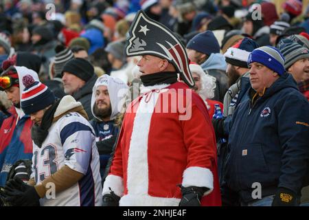 FOXBOROUGH MA DECEMBER 24 A New England Patriots fan wearing a foam Patriots hat and dressed as Santa Claus attends a game between the New England Patriots and the Cincinnati Bengals on December 24 20...