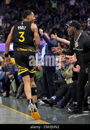 San Francisco 49ers wide receiver Deebo Samuel, middle, sits courtside as  he watches an NBA basketball game between the Golden State Warriors and the  Phoenix Suns in San Francisco, Tuesday, Jan. 10