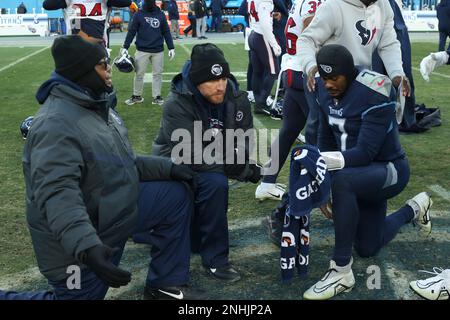 NASHVILLE, TN - DECEMBER 24: Tennessee Titans running back Derrick Henry  (22) stiff arms Houston Texans safety Jalen Pitre (5) during a game between  the Tennessee Titans and the Houston Texans, December