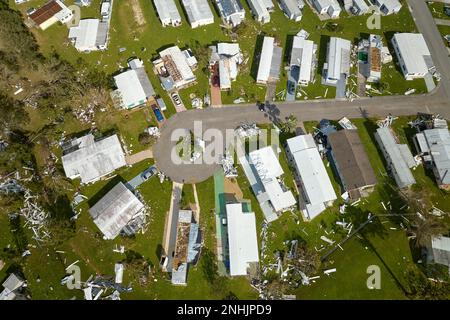 Destroyed by hurricane Ian suburban houses in Florida mobile home residential area. Consequences of natural disaster. Stock Photo