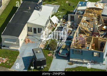 Destroyed by hurricane Ian suburban houses in Florida mobile home residential area. Consequences of natural disaster. Stock Photo