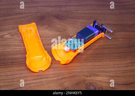 rechargeable torch inside, led bulb and circuit with the battery. Stock Photo