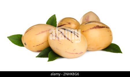 Fresh ripe pepino melons with green leaves on white background Stock Photo