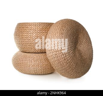 Three stylish wicker poufs on white background Stock Photo