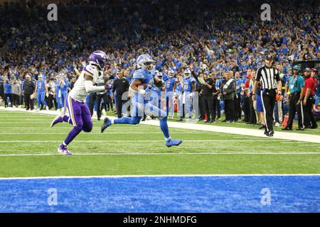 DETROIT, MI - DECEMBER 11: Detroit Lions running back Justin Jackson (42)  runs with the ball to the corner of the end zone for a touchdown while  being chased by Minnesota cornerback