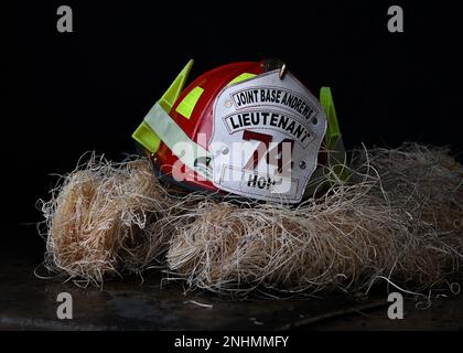 A helmet worn by a firefighter from the 316th Civil Engineer Squadron at Joint Base Andrews, Md., July 30, 2022. The 316th Civil Engineer Squadron’s fire department hosted firefighting training for eight cadets from the National Capital Region during the last week of July. Stock Photo