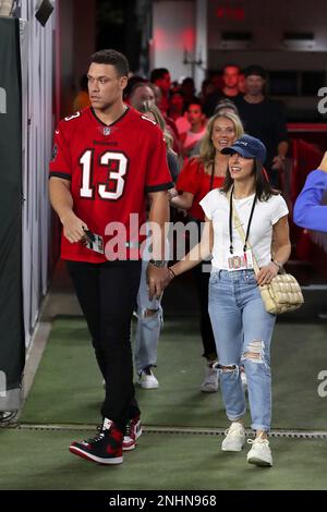 TAMPA, FL - DECEMBER 05: 2022 American League MVP Aaron Judge talks with  friends before the regular season game between the New Orleans Saints and  the Tampa Bay Buccaneers on December 05