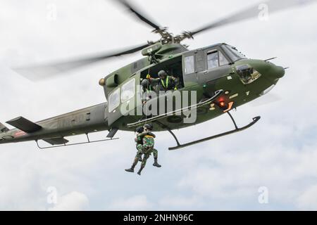 Indonesian Soldiers conduct live hoist training during Exercise Super Garuda Shield 22 at Baturaja, Indonesia on Aug. 1, 2022. Super Garuda Shield, a part of Operation Pathways and a longstanding annual, bilateral military exercise conducted between the U.S. military and Indonesia National Armed Forces, reinforces the U.S. commitments to our allies, and regional partners, joint readiness, and the interoperability to fight and win together. Stock Photo