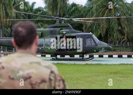 Indonesian Soldiers conduct live hoist training during Exercise Super Garuda Shield 22 while a U.S. Army MEDEVAC pilot looks on at Baturaja, Indonesia on Aug. 1, 2022. Super Garuda Shield, a part of Operation Pathways and a longstanding annual, bilateral military exercise conducted between the U.S. military and Indonesia National Armed Forces, reinforces the U.S. commitments to our allies, and regional partners, joint readiness, and the interoperability to fight and win together. Stock Photo