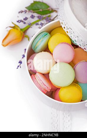 Colorful macaroons in a gift box on a white table Stock Photo