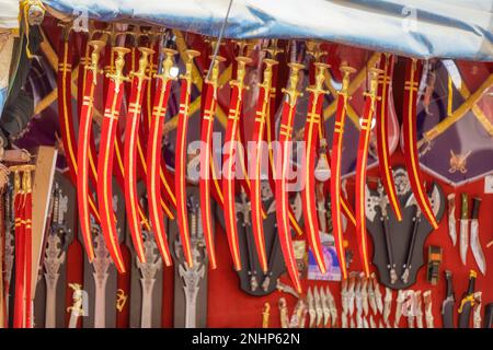 Pushkar displayed toy swords, Rajasthan India Stock Photo