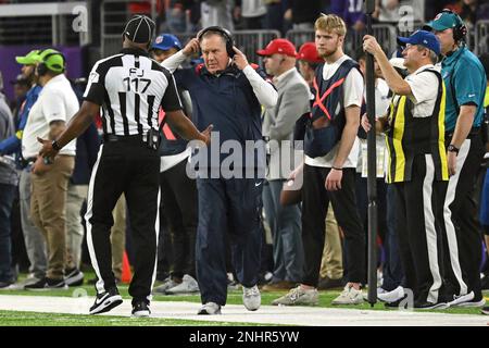 MINNEAPOLIS, MN - NOVEMBER 24: New England Patriots quarterback Mac Jones  (10) directs traffic while on the run during a game between the Minnesota  Vikings and New England Patriots on November 24