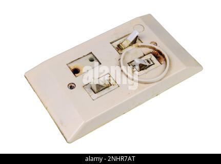 Old broken retro voltage switch isolated on white Stock Photo