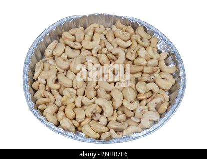 Peeled cashew nuts in a plastic box . Isolated on white Stock Photo