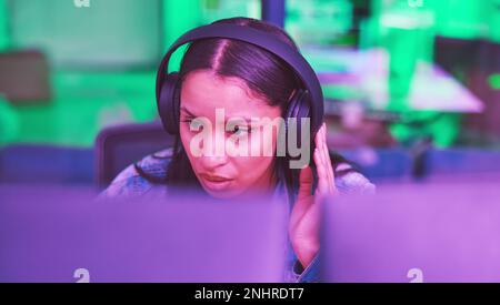 Developer, computer or headphones in neon programming for iot coding, night SEO thinking or code cybersecurity. Programmer, woman or desktop Stock Photo