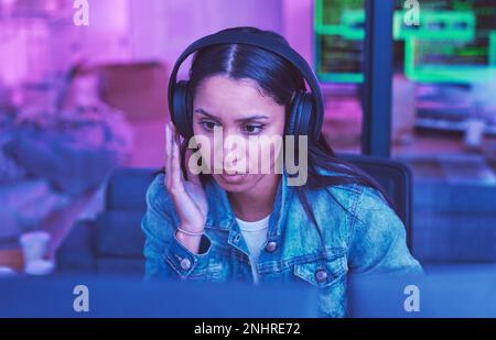 Developer, computer or headphones in neon coding for cybersecurity iot, night SEO thinking or code programming. Programmer, woman or desktop Stock Photo