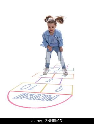 Cute little girl playing hopscotch on white background Stock Photo