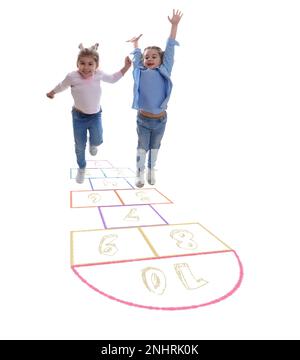 Cute little girls playing hopscotch on white background Stock Photo