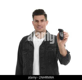 Man with modern breathalyzer on white background Stock Photo