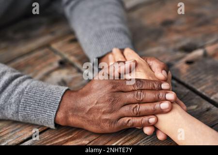 I will always be here for you. High angle shot of an unrecognizable senior couple holding hands in comfort outside. Stock Photo