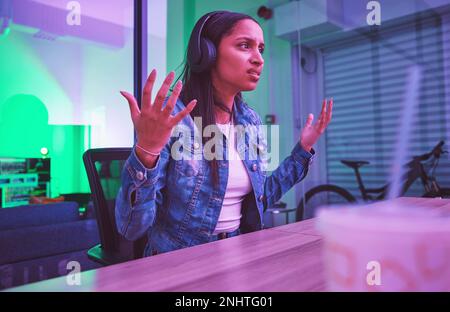 Woman, headphones or stress in neon house basement in esports burnout, 404 gaming glitch or challenge fail. What, confused or gamer in dark home with Stock Photo