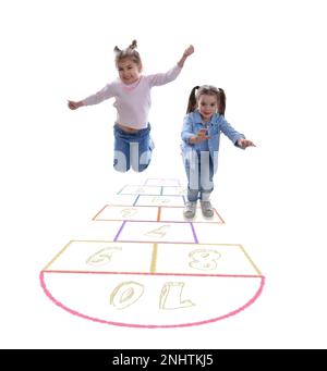 Cute little girls playing hopscotch on white background Stock Photo