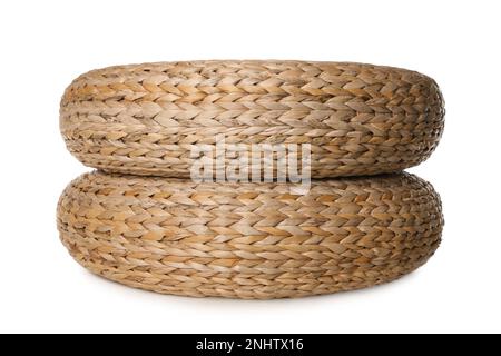 Two stylish wicker poufs on white background Stock Photo