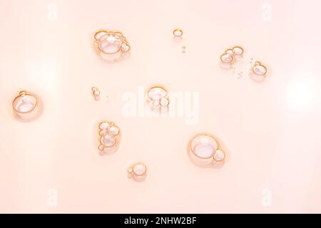 Glycerin gel texture. Transparent serum toner drop on pink background. Liquid gel moisturizer with bubbles macro Stock Photo