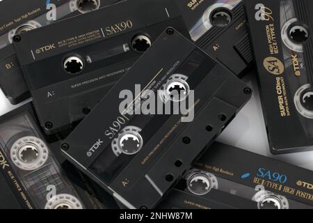Poznan, Poland - July 11, 2022 Black old cassette tapes on a table.Top view close-up photography. Stock Photo