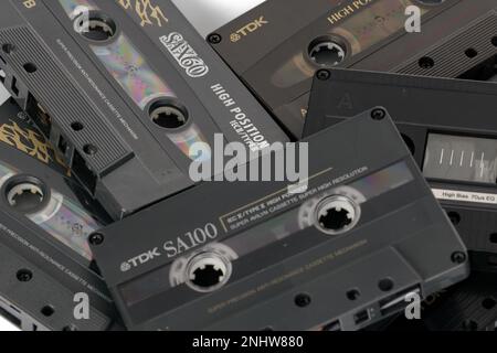 Poznan, Poland - July 11, 2022 Pile old cassette tapes on a table.Top view close up photography. Stock Photo