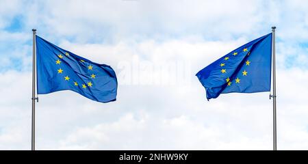 Two European Union flags or flag of EU against blue sky, concept political picture Stock Photo