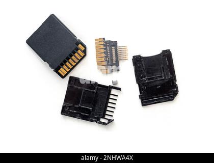 Pieces of broken memory card, SD or memory data isolated on white, top view Stock Photo