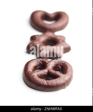 Sweet chocolate heart, star and pretzel isolated on the white background. Stock Photo