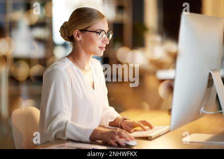 Serious, research and woman on a computer for email, software development and programming. Web design, database and employee working on coding Stock Photo