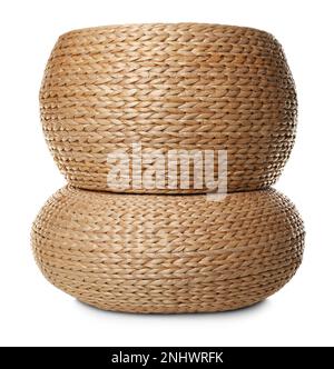 Two stylish wicker poufs on white background Stock Photo