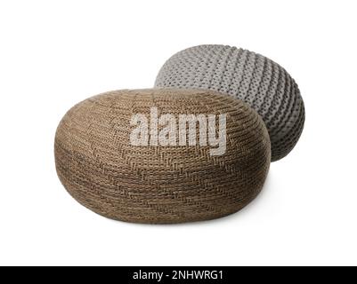Different stylish knitted poufs on white background Stock Photo