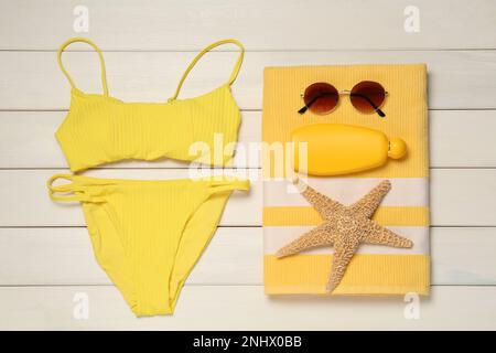 Flat lay composition with beach accessories on white wooden background Stock Photo