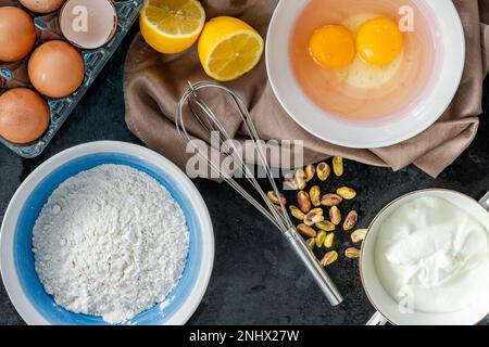 Ingredients for lemon and pistachio cake - overhead view Stock Photo