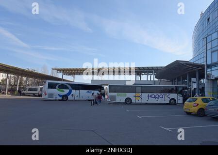 Passengers getting on long distance buses at Sofia central bus station, Bulgaria Stock Photo