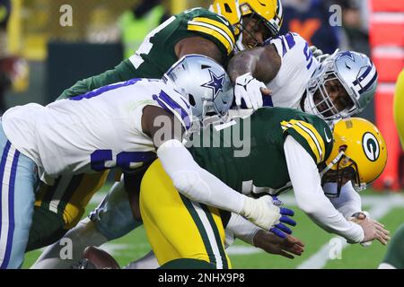 GREEN BAY, WI - NOVEMBER 13: Green Bay Packers safety Darnell Savage (26)  tackles Dallas Cowboys running back Tony Pollard (20) during a game between  the Green Bay Packers and the Dallas