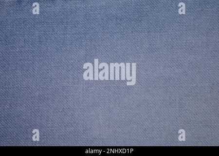Sky blue jeans fabric background texture. Sky blue jeans fabric cloth textile material. Stock Photo