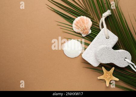 Flat lay composition with pumice stones on brown background. Space for text Stock Photo