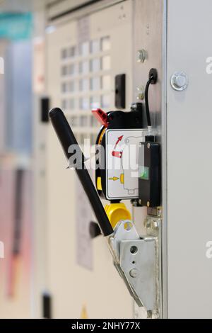 Industrial power distribution cabinet and circuit breaker switch close up. Selective focus. Stock Photo